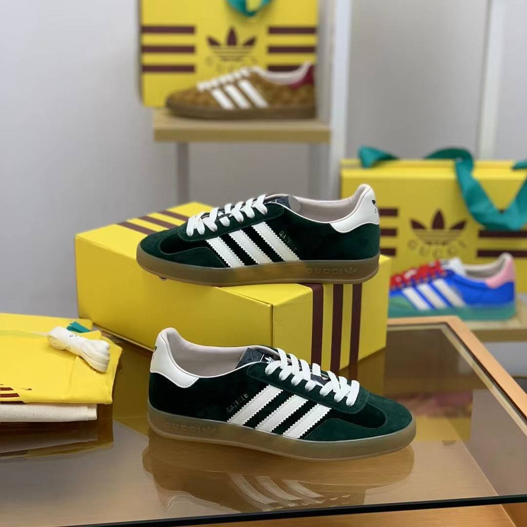 GU*I× Adidas sneakers